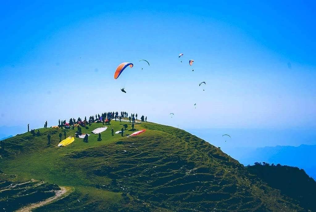 Paragliders launching from Billing