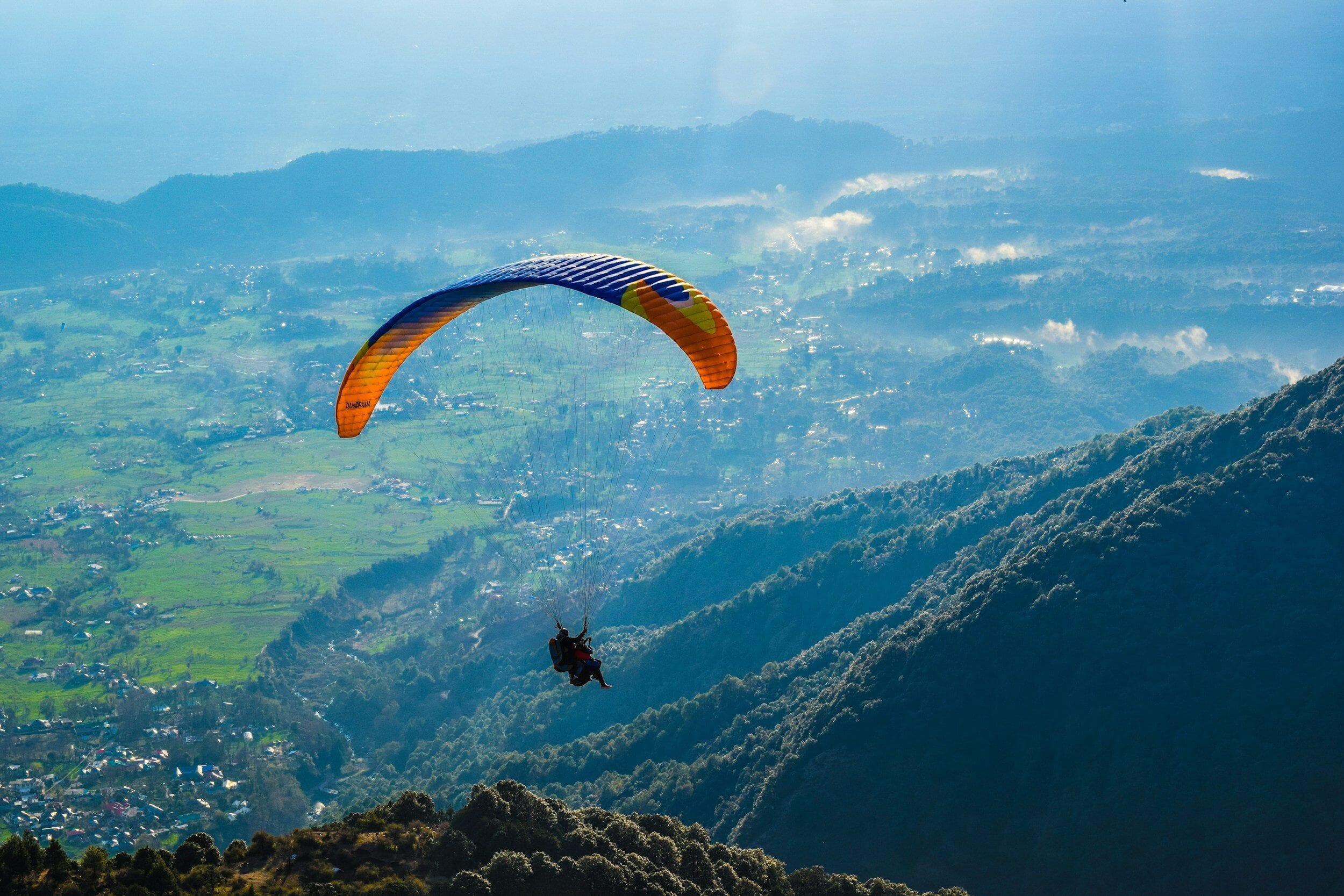 A paraglider above the Kangra landscape